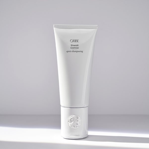 White hair care product tube on table