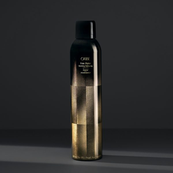 Luxurious black and gold styling spray bottle