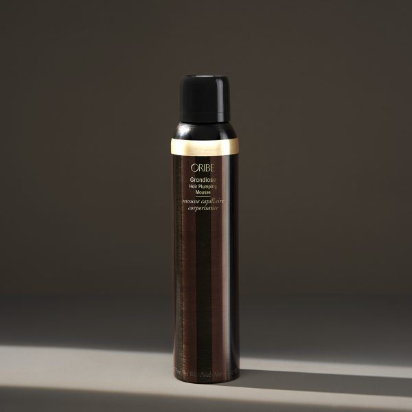 Luxury hair mousse bottle on neutral background