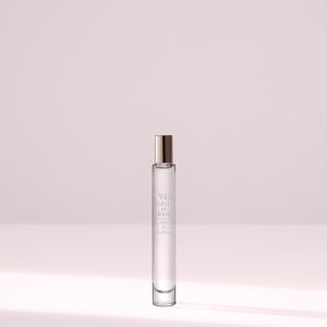 Elegant perfume bottle on light background tabletop.