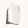 Creamy skincare product texture on white background