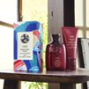 Colorful hair care products on wooden table