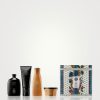 Luxury hair care product set with packaging.